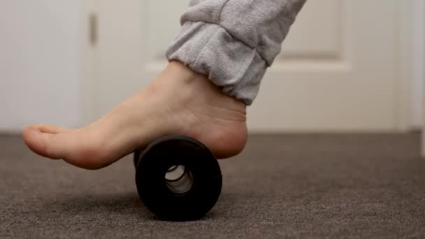 Woman Doing Flatfoot Correction Gymnastic Exercise Using Massage Roller Myofascial — Stock Video