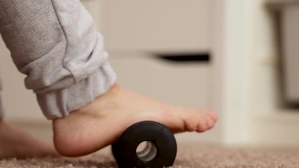 Woman Doing Flatfoot Correction Gymnastic Exercise Using Massage Roller Myofascial — Stock Video