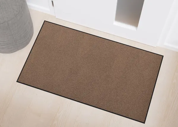 Blank brown door mat on wooden floor, perfect for showcasing custom designs or logos in an urban home setting. Welcome mat with copy space. Doormat mock up. Carpet at entrance. 3D