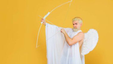 Valentines Day concept. God of love. Cupid aiming with bow and arrow. Valentine day and love