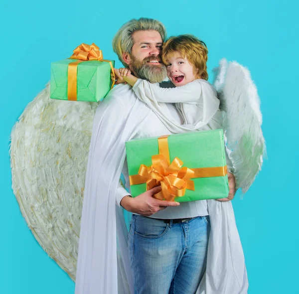 Little child angel and bearded man with gift. Father and son Angels in white wings. Valentines day