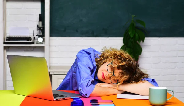Back to school. Sleeping female student in classroom. Young student preparing for exams. Homework. Knowledge, education and learning concept. Tired overworked teacher woman sleep at desk. School job