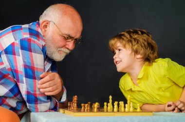 Grandpa teaches grandchild to play chess. Development of logic and strategic thinking. Grandfather and grandson playing chess at home. Old man thinking about next move in game of chess. Game of chess clipart