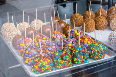 Delicious chocolate covered candy apples in a storefront window