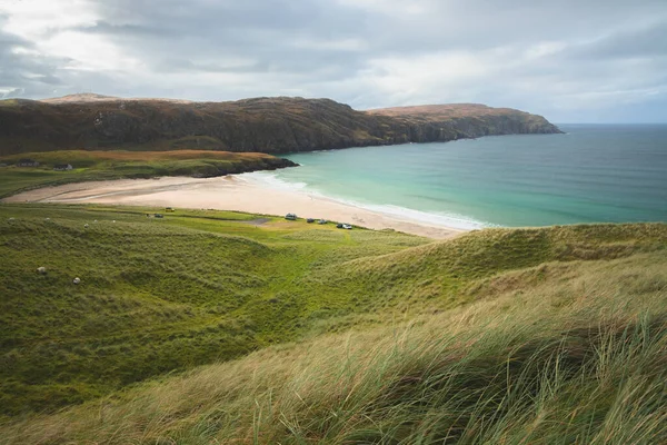 stock image Beautiful seascape landscape over headland and sandy bay at Reef Beach on the Isle of Lewis and Harris in the Outer Hebrides of Scotland, UK.