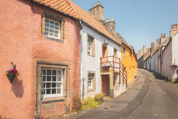 stock image Charming and quaint old town lane and colourful harling cottages in the medieval village of Culross, a popular filming location in Fife, Scotland, UK.