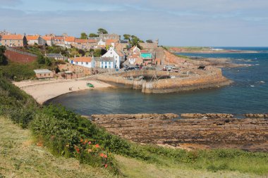View of the quaint and picturesque harbour of the seaside fishing village Crail on a sunny summer day in East Neuk, Fife, Scotland. clipart