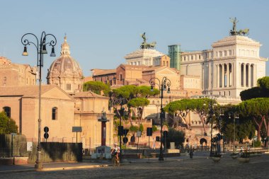 Rome, Italy - August 27, 2023: Historic landmarks and ancient  sites including the Roman Forum and Monument to Victor Emmanuel II along Via dei Fori Imperiali. clipart