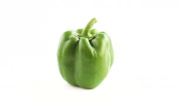 Whole Green Fresh Bell Pepper Capsicum White Background Rotating Top — Stock Video