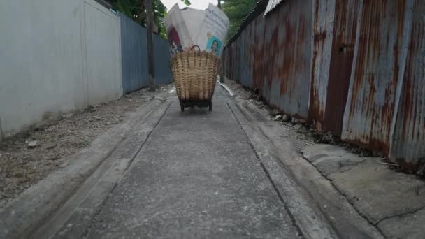 Huge Rattan Basket Being Pulled Narrow Street Wide Shot — Stock Video