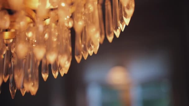Detail Crystal Drops Chandelier Foreground Slow Motion — Stock Video