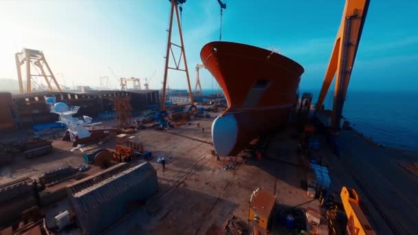 Dock Workers Work Vessel Hull Ship Repair Drydock Aerial View — Stock Video