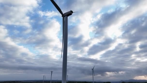 Low Angle Pedestal Inoperative Wind Turbine Cloudy Sky Background Coll — Stock Video