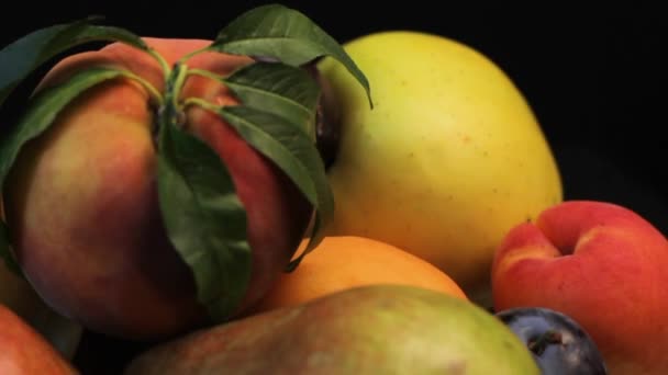 Close Fresh Colorful Seasonal Fruit Spinning Plate Black Background — Stock Video