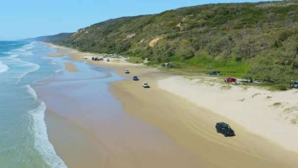 Aerial Drone Cars Driving Sandy Beach Shore Ocean Waves — Stock Video