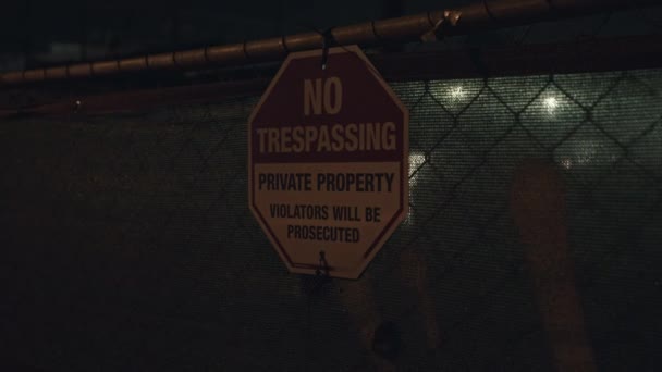 Close Shot Warning Board City Clearly Mentioned Trespassing Night — Stock Video