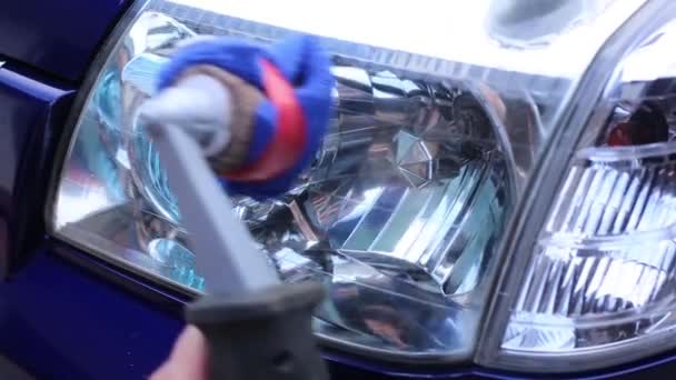Man Polishing Headlights His Car Using Special Material Liquids Clean — Stock Video