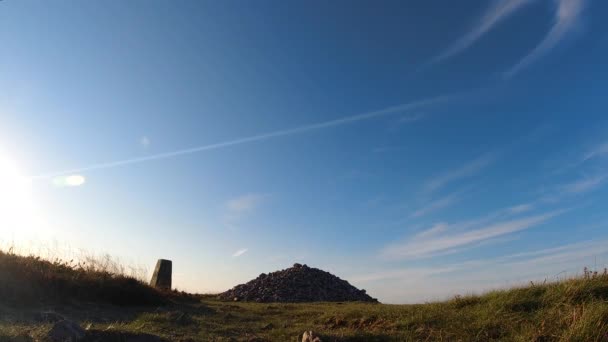 Timelapse Stone Cairn Mountain Peak Sun Flare Blue Sky Clouds — Wideo stockowe