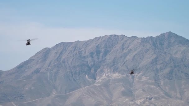 Two Helicopters Fly Mountains Kabul Afghanistan — Stock Video