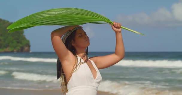 Pretty Young Female Shades Palm Leaf Tropical Beach — Video