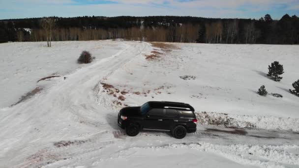 4Runner Roading Snowy Field Aerial Drone Shot Horizontal Video — Vídeo de stock