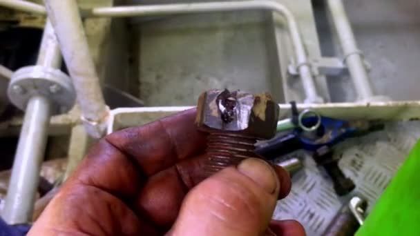 Male Hand Covered Oil Grease Holding Rusty Bolt — Stock Video