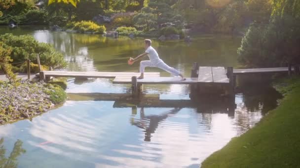White Caucasian Adult Man Practices Yoga Peaceful Lush Forest Garden — Stock Video