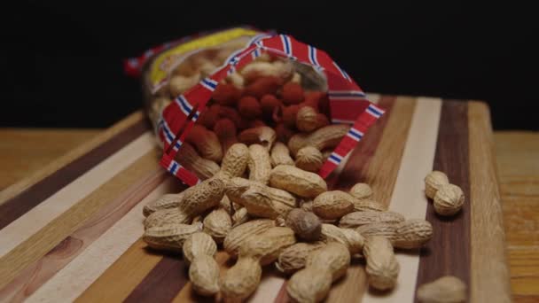 Bag Peanuts Spinning Cutting Board — Stock Video