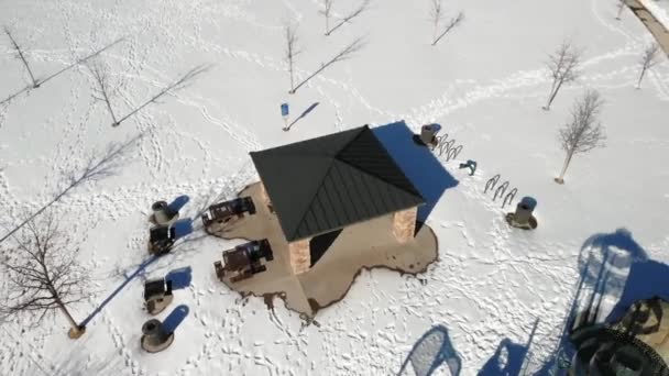 Snowy Playground Kids Playaying Aerial Drone Shot Clockwise Rotation — стокове відео