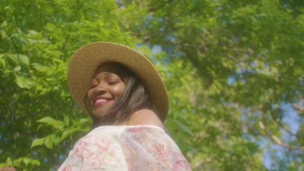 Black Woman Walking Smiling Picnic Park Low Angle — Video