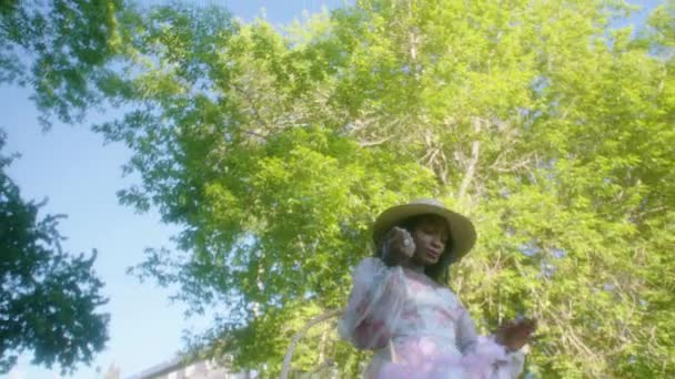 Black Woman Walking Park Dress Basket Low Angle — 비디오
