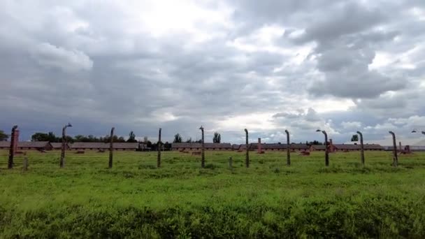 Auschwitz Concentration Camp Wooden Barracks Surrounded Barbed Wire Fence Poland — Stock Video
