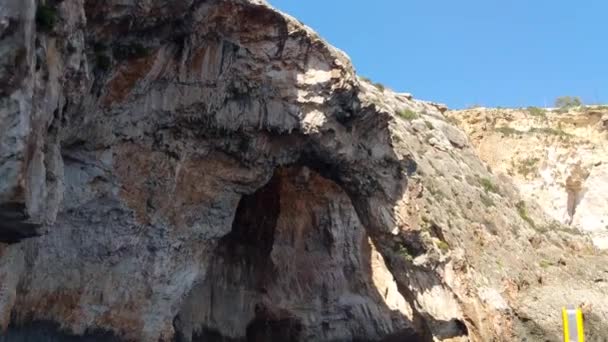 Traditional Maltese Luzzu Tourist Boat Approaching Blue Grotto Rocky Coastline — Stock Video