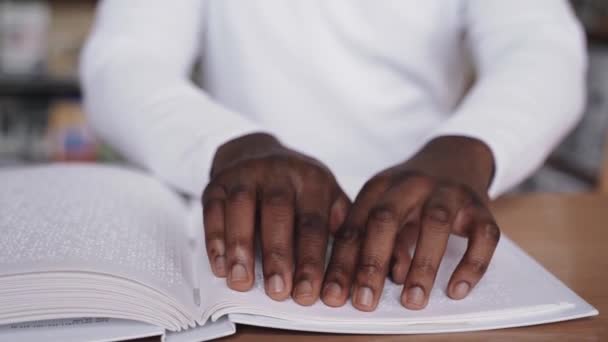 Blind African Man Reading Book Using Braille Alphabet — Vídeo de stock