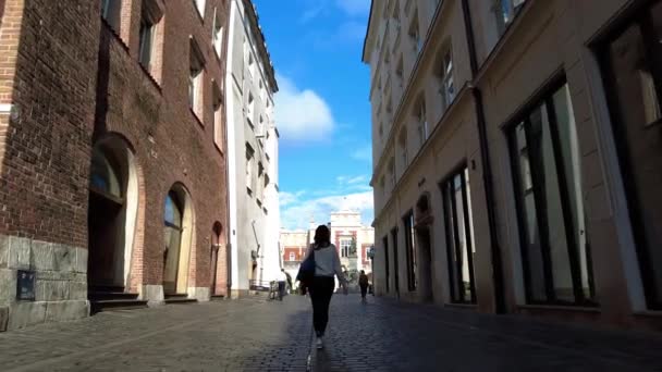 Female Traveler Strolling Historic Town Square Krakow Poland Tracking Shot — Vídeos de Stock