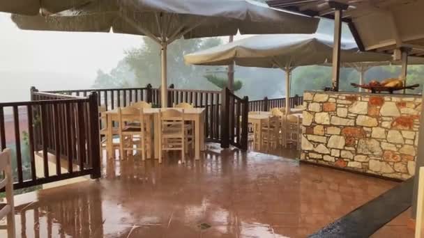 Hand Held View Heavy Rain Tropical Thunderstorm Patio Area Taverna — стокове відео