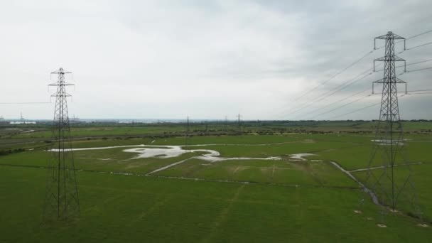 Rising Aerial View Electric Distribution Pylon Towers Flooded Countryside Field — Vídeos de Stock