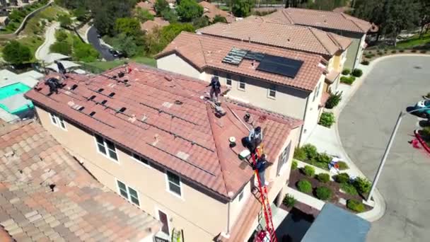 Aerial View Solar Panels Being Installed Roof House Workers Pedestal — Stock Video