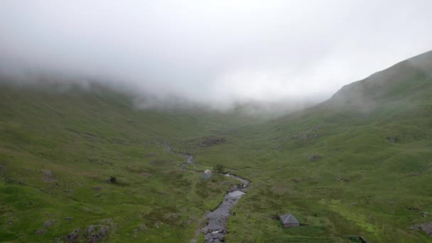 Aerial Drone Footage Flying Backwards Trough Low Hanging Cloud Scottish — Stock Video