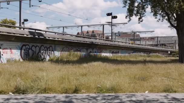 Slowmotion Dolly Shot Tram Driving Tracks Graffiti Walls — Stock Video