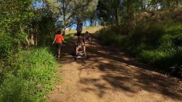 Young Twins Race Wooden Billy Carts Dirt Road Friends Rural — Stock Video