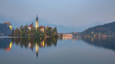 Stunning sunset view of popular tourist destination  Bled lake. Dramatic view of Pilgrimage Church of the Assumption of Maria. Location: Bled, Upper Carniolan region, Slovenia, Europe