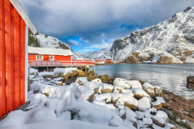 Outstanding morning seascape of Norwegian sea and cityscape of Nusfjord village. Popular travel destination on Lofotens. Location: Nusfjord, Flakstad Municipality, Lofoten; Norway, Europe