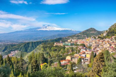 Awesome view of Taormina resorts and Etna volcano mount. Giardini-Naxos bay, Ionian sea coast, Taormina, Sicily, Italy.