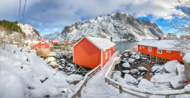 Outstanding morning seascape of Norwegian sea and cityscape of Nusfjord village. Popular travel destination on Lofotens. Location: Nusfjord, Flakstad Municipality, Lofoten; Norway, Europe