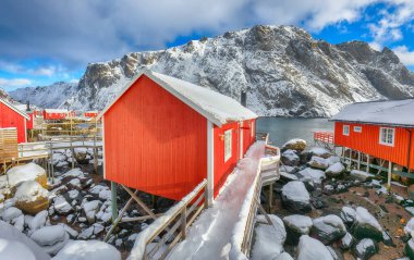 Outstanding morning seascape of Norwegian sea and cityscape of Nusfjord village. Popular travel destination on Lofotens. Location: Nusfjord, Flakstad Municipality, Lofoten; Norway, Europe
