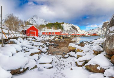 Outstanding morning seascape of Norwegian sea and cityscape of Nusfjord village. Popular travel destination on Lofotens. Location: Nusfjord, Flakstad Municipality, Lofoten; Norway, Europe