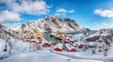 Awesome morning seascape of Norwegian sea and cityscape of Nusfjord village. Popular travel destination on Lofotens. Location: Nusfjord, Flakstad Municipality, Lofoten; Norway, Europe