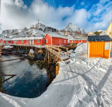 Amazing morning seascape of Norwegian sea and cityscape of Nusfjord village. Popular travel destination on Lofotens. Location: Nusfjord, Flakstad Municipality, Lofoten; Norway, Europe