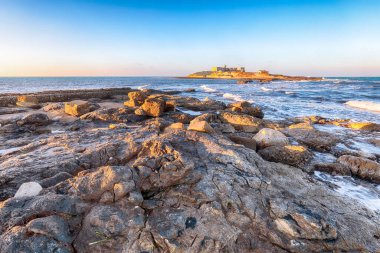 Dramatic morning scene of awesome spring seascape on the Passero cape Sicily.  Location: Island Sicilia, cape Passero, Italy, Europe, Mediterranean sea.